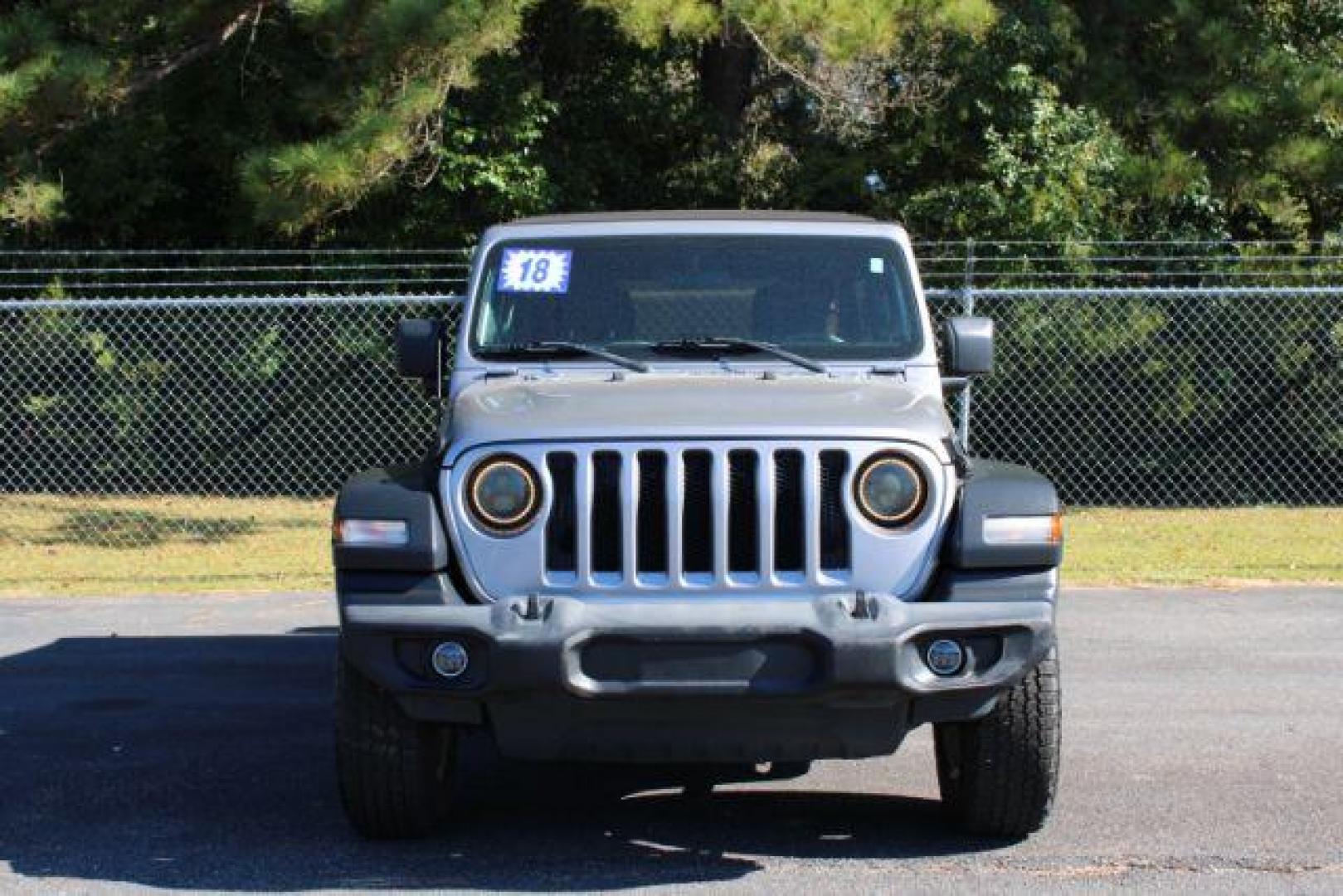 2018 Jeep Wrangler Unlimited Sport (1C4HJXDG1JW) with an 3.6L V6 DOHC 24V FFV engine, 6-Speed Automatic transmission, located at 9146 Ocean Hwy West, Calabash, NC, 28467, (910) 579-1110, 33.928635, -78.576157 - 2018 Jeep Wrangler Unlimited Sport - Photo#3