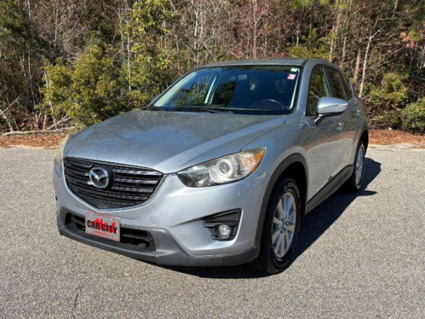 2016 /Black, premium cloth Mazda CX-5 Touring (JM3KE2CY2G0) with an 2.5L L4 DOHC 16V engine, 6-Speed Automatic transmission, located at 9146 Ocean Hwy West, Calabash, NC, 28467, (910) 579-1110, 33.928635, -78.576157 - 2016 Mazda CX-5 Touring - Photo#0