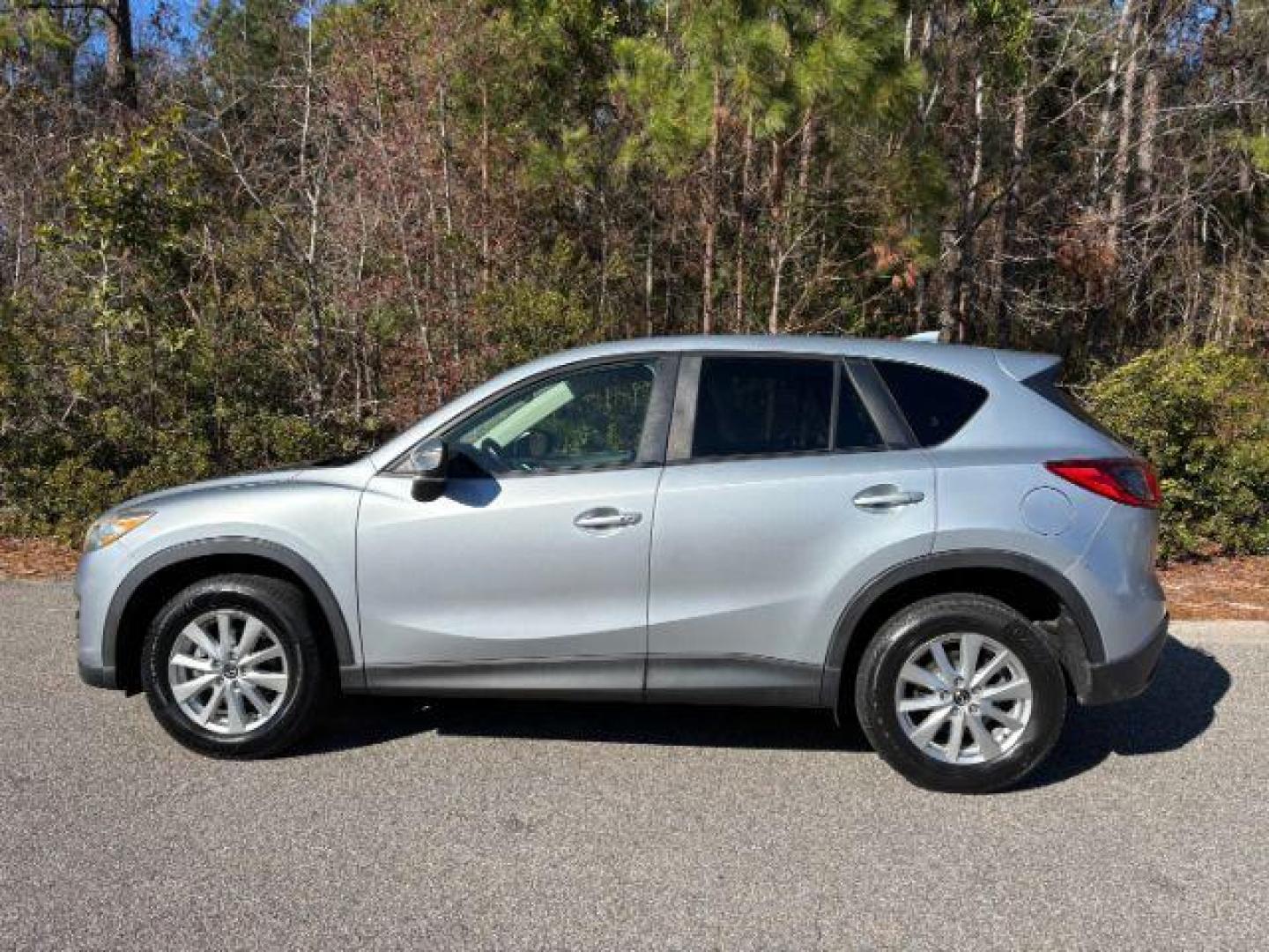 2016 /Black, premium cloth Mazda CX-5 Touring (JM3KE2CY2G0) with an 2.5L L4 DOHC 16V engine, 6-Speed Automatic transmission, located at 9146 Ocean Hwy West, Calabash, NC, 28467, (910) 579-1110, 33.928635, -78.576157 - 2016 Mazda CX-5 Touring - Photo#1