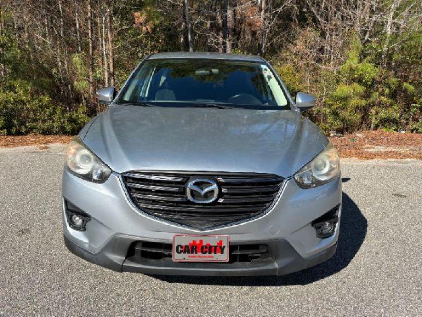 2016 /Black, premium cloth Mazda CX-5 Touring (JM3KE2CY2G0) with an 2.5L L4 DOHC 16V engine, 6-Speed Automatic transmission, located at 9146 Ocean Hwy West, Calabash, NC, 28467, (910) 579-1110, 33.928635, -78.576157 - 2016 Mazda CX-5 Touring - Photo#2