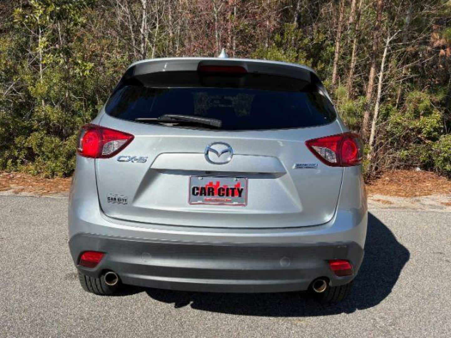 2016 /Black, premium cloth Mazda CX-5 Touring (JM3KE2CY2G0) with an 2.5L L4 DOHC 16V engine, 6-Speed Automatic transmission, located at 9146 Ocean Hwy West, Calabash, NC, 28467, (910) 579-1110, 33.928635, -78.576157 - 2016 Mazda CX-5 Touring - Photo#3