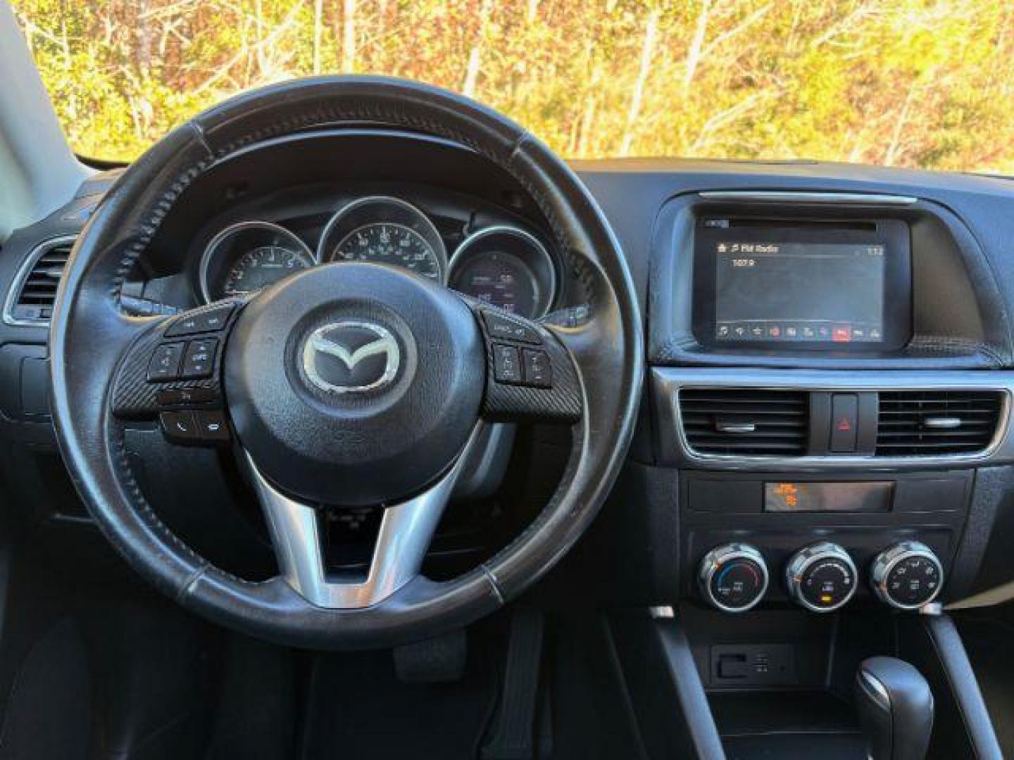 2016 /Black, premium cloth Mazda CX-5 Touring (JM3KE2CY2G0) with an 2.5L L4 DOHC 16V engine, 6-Speed Automatic transmission, located at 9146 Ocean Hwy West, Calabash, NC, 28467, (910) 579-1110, 33.928635, -78.576157 - 2016 Mazda CX-5 Touring - Photo#5