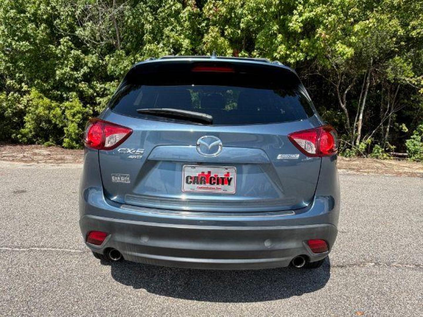 2016 /Black, leather Mazda CX-5 Grand Touring AWD (JM3KE4DY3G0) with an 2.5L L4 DOHC 16V engine, 6-Speed Automatic transmission, located at 2761 East Hwy 501, Conway, SC, 29526, (843) 331-1151, 33.781528, -78.989883 - 2016 Mazda CX-5 Grand Touring AWD - Photo#4