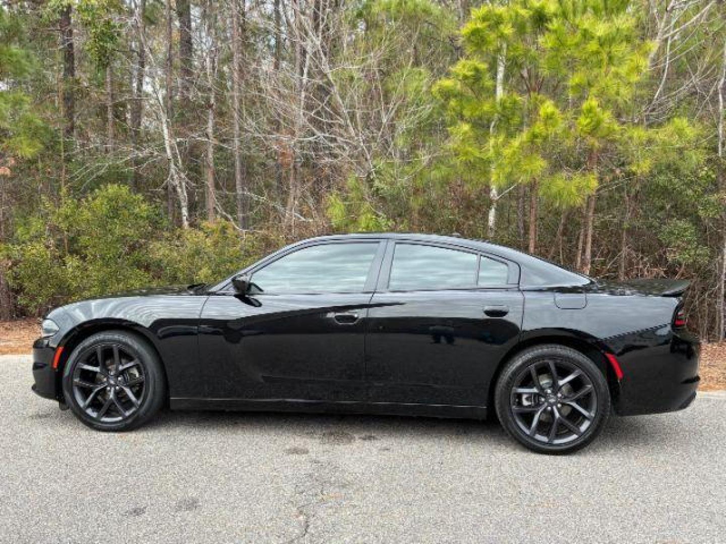 2021 /Black, cloth Dodge Charger SXT (2C3CDXBG5MH) with an 3.6L V6 DOHC 24V engine, 8-Speed Automatic transmission, located at 9146 Ocean Hwy West, Calabash, NC, 28467, (910) 579-1110, 33.928635, -78.576157 - 2021 Dodge Charger SXT - Photo#1